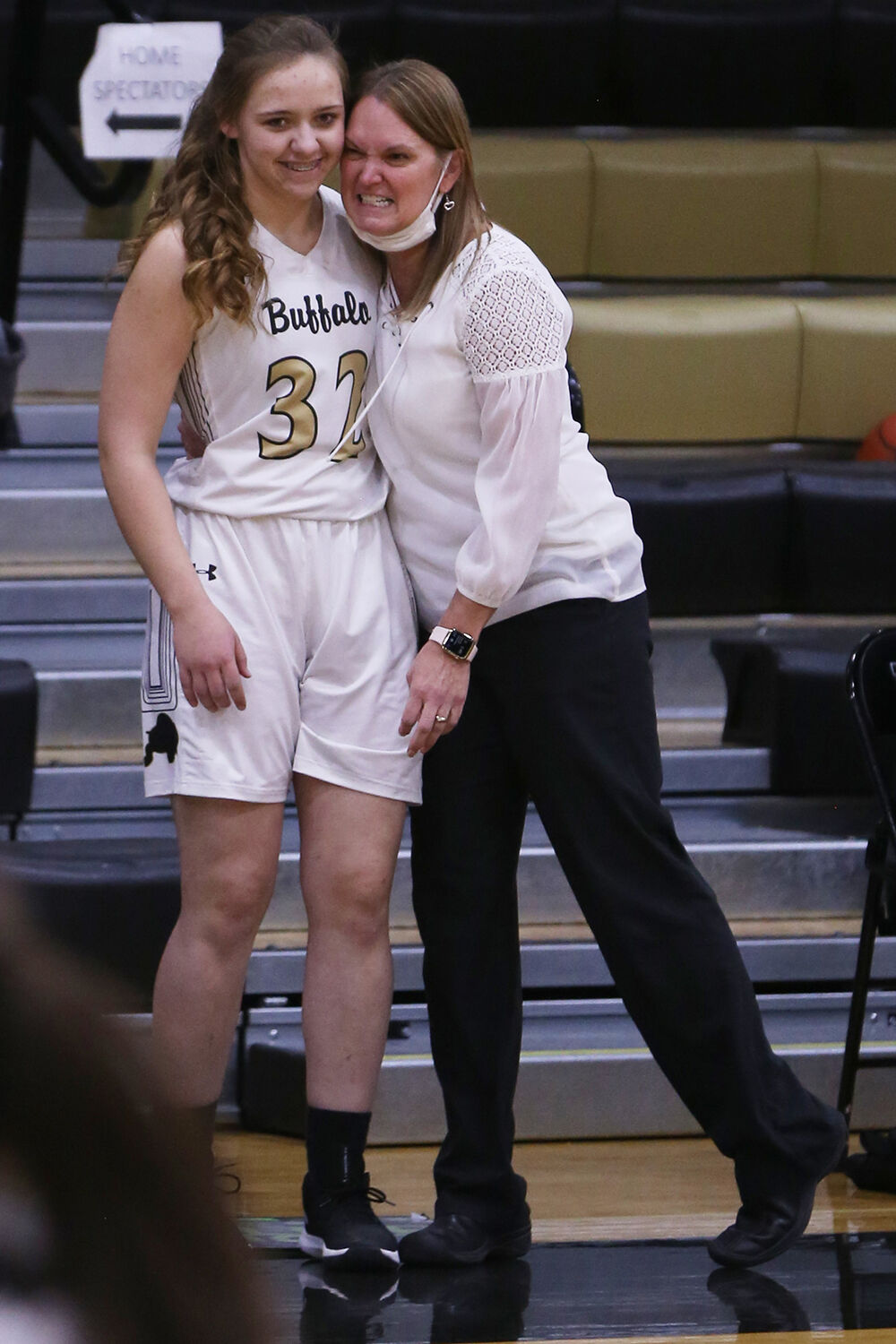 Michelle Dahlberg hugs junior McKinly Hepp